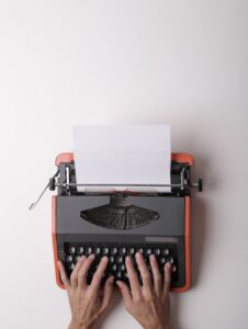 writer working on typewriter in office